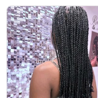 Senegalese twists in front of the Signature Wall