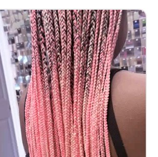 Box braids styled at Unique